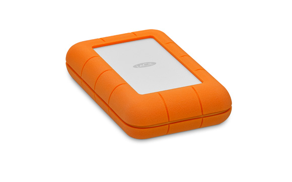 An orange LaCie external hard drive with a white center panel on a white background.