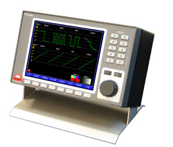 A gray electronic testing device with a large digital screen and various control buttons and knobs.