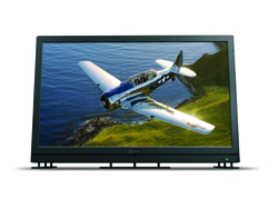 Flat-screen television showing a vintage airplane in flight over a rocky coastline with green hills.