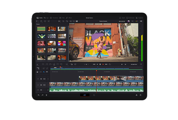 A tablet showing a video editing interface with a timeline and a video of a person dancing in front of a mural.