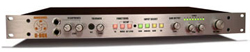 Silver rack-mounted audio processor with various knobs, buttons, and indicator lights on the front panel.