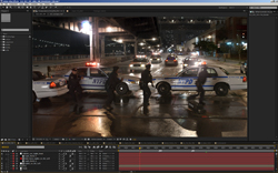 Video editing software displaying a nighttime street scene with NYPD police cars and officers.