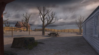 Bare, leafless trees stand in a barren field under a dark, overcast sky near a wooden structure.
