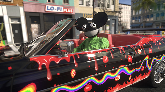 A figure in a black mouse mask and green shirt drives a black convertible with colorful drip patterns.