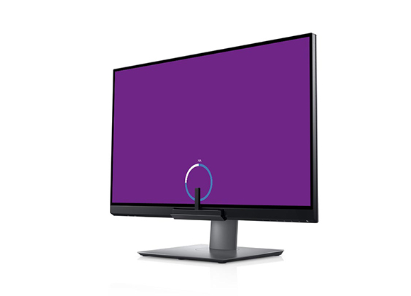 A black computer monitor displaying a solid purple screen with a blue loading circle in the center.