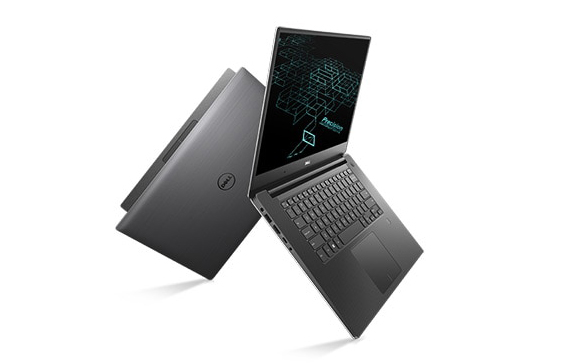 Two dark grey Dell Precision laptops floating against a white background.