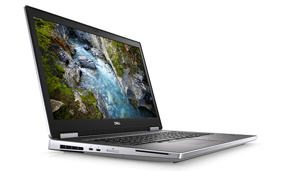 A silver Dell laptop open at an angle, displaying a mountain river landscape on the screen.
