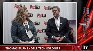 A woman with curly hair interviews a man in a dark suit against a Post TV logo background.
