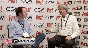 Two men in button-down shirts engage in conversation in front of a branded CGW backdrop.