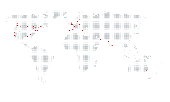 A gray dotted world map with scattered red dots indicating various global locations.