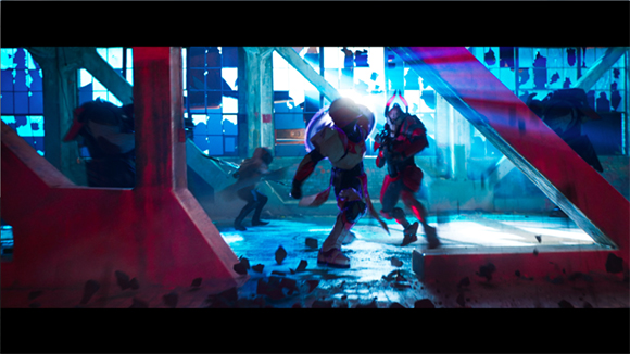 Characters in futuristic gear engage in combat within a blue-lit, industrial room with broken windows.