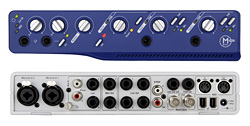A blue audio interface above a white audio interface, both featuring various knobs, jacks, and ports.