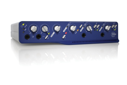 A blue audio interface device with several silver control knobs and input jacks on a white reflective surface.