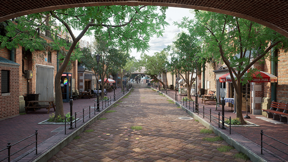 A brick walkway lined with trees and storefronts under a clear sky, framed by a brick archway.