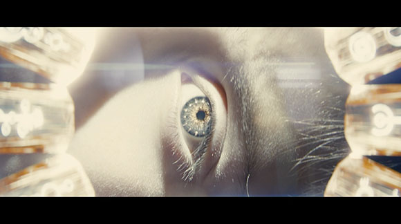 Extreme close-up of a single human eye surrounded by glowing, abstract light patterns.