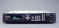 Front view of a black Dolby audio processor with a digital display and various control buttons.