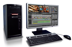 Desktop computer with a black tower, a wide monitor displaying video editing software, a keyboard, and a mouse.