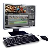 A computer monitor displaying video editing software, a keyboard, and a mouse on a white background.