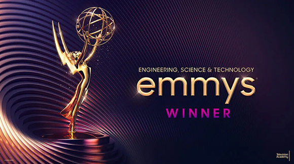 Golden Emmy statuette on a dark purple background with wavy lines and text reading Engineering, Science & Technology Emmys Wi