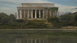 A large, classical stone monument with columns, partially covered in vines and surrounded by dense vegetation.