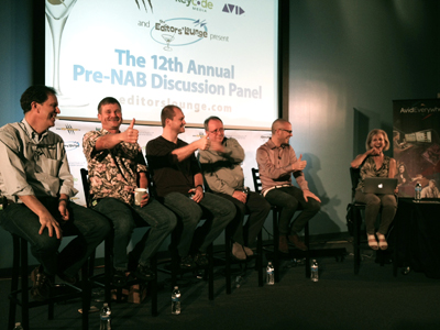 Six people seated on stools in front of a screen that reads "The 12th Annual Pre-NAB Discussion Panel". Five men are on the l