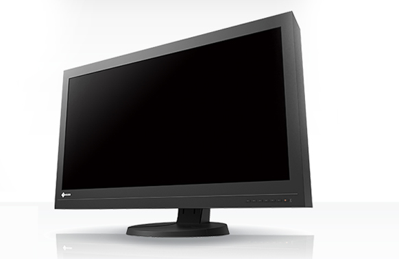 A black widescreen computer monitor with a dark screen on a circular stand against a white background.