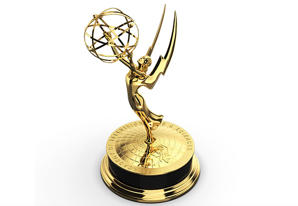 A gold Emmy Award trophy featuring a winged figure holding an atom.