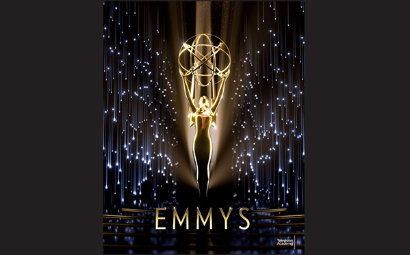 Golden Emmy statuette silhouette against a backdrop of falling blue and white lights.