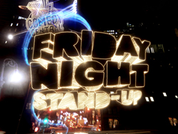 Stylized 3D text reading 'Friday Night Stand-Up' glowing against a dark city background.