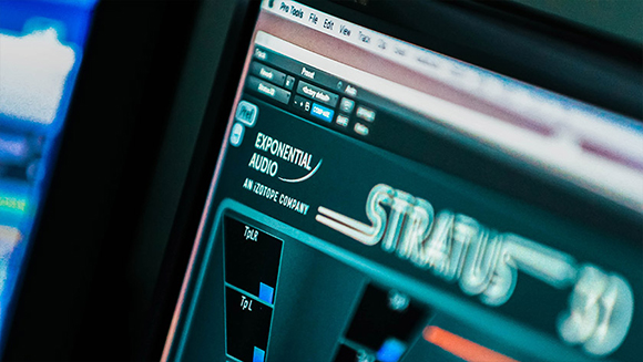 A close-up, angled view of a computer monitor displaying the Exponential Audio Stratus software interface.