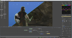 Video editing software interface displaying a person in a brown garment against a rocky background.