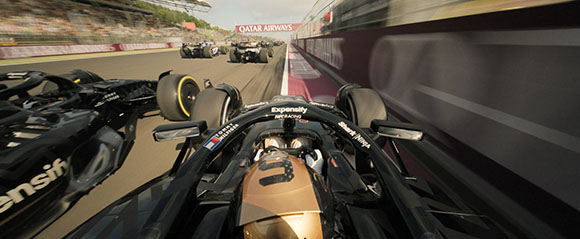 First-person view from a black Formula 1 racing car on a track with other cars ahead.
