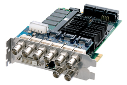 An electronic circuit board with various connectors, including BNC and serial ports, on a metal bracket.