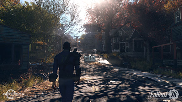 A person in a blue jumpsuit walks down a cracked road toward a small robot in a sunlit, ruined town.