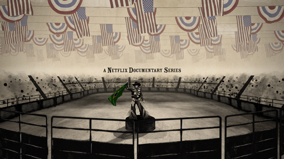 A figure in a cowboy hat stands in a rodeo ring under a ceiling decorated with American flag bunting.