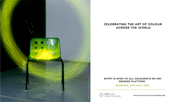 A green chair sits in a dark space surrounded by glowing, circular light trails.