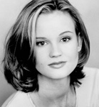 Black and white headshot of a young woman with shoulder-length hair looking at the camera.