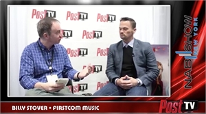 A man in a blue plaid shirt interviews a man in a grey blazer against a Post TV logo background.