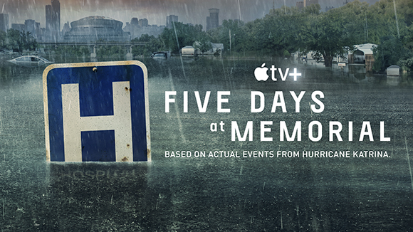 A blue hospital sign partially submerged in floodwaters against a backdrop of a flooded city skyline.