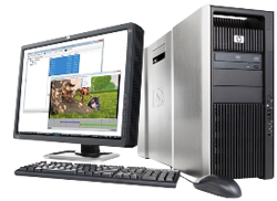 A silver HP desktop computer tower, a monitor displaying software, a black keyboard, and a computer mouse.