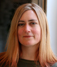 A woman with long blonde hair looking directly at the camera.