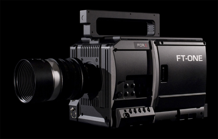 A black professional FT-ONE cinema camera with a large attached lens against a black background.