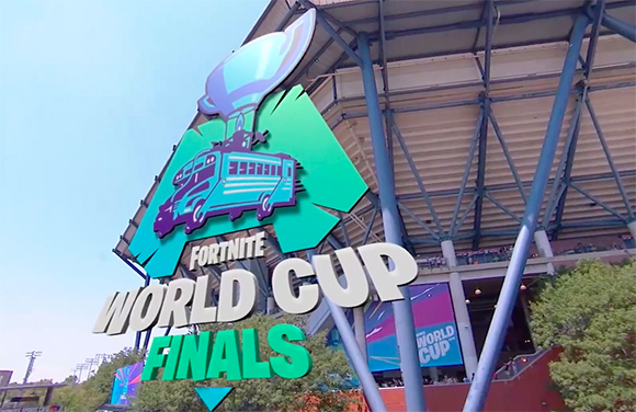 Fortnite World Cup Finals logo featuring a teal battle bus against a stadium structure.