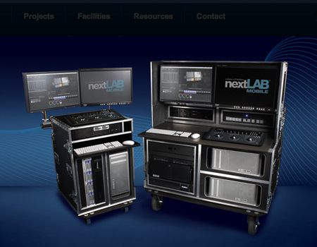 Two mobile production racks with multiple monitors and control interfaces against a blue background.