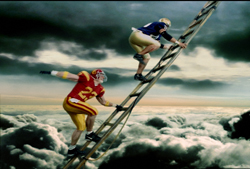 Two football players in different colored uniforms climb a long ladder ascending through a cloudy sky.