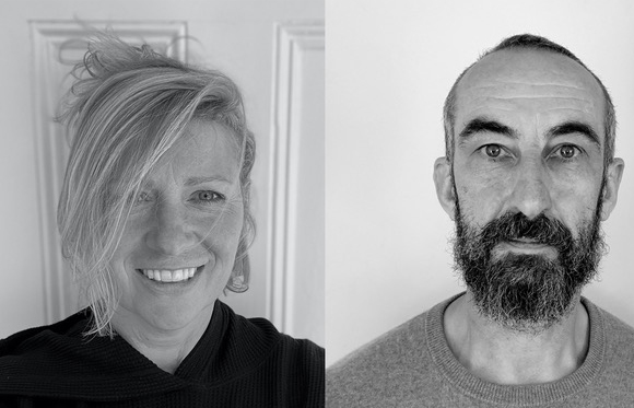 Black and white split portrait of a smiling woman with blonde hair and a bearded man.