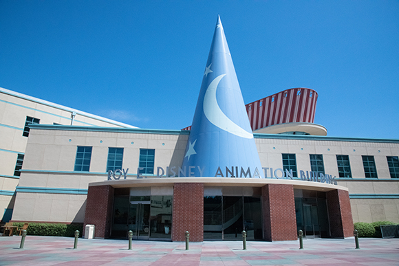The Roy E. Disney Animation Building entrance is topped by a large blue cone resembling Sorcerer Mickey's hat, complete with