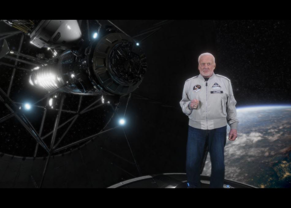An older man in a white flight jacket stands in a spacecraft module with Earth visible in the background.