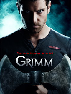 A man stares intensely at the camera, holding a large axe in front of the title 'Grimm'.