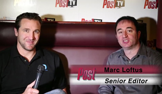 Two men sit on a dark red couch in front of a Post TV backdrop.